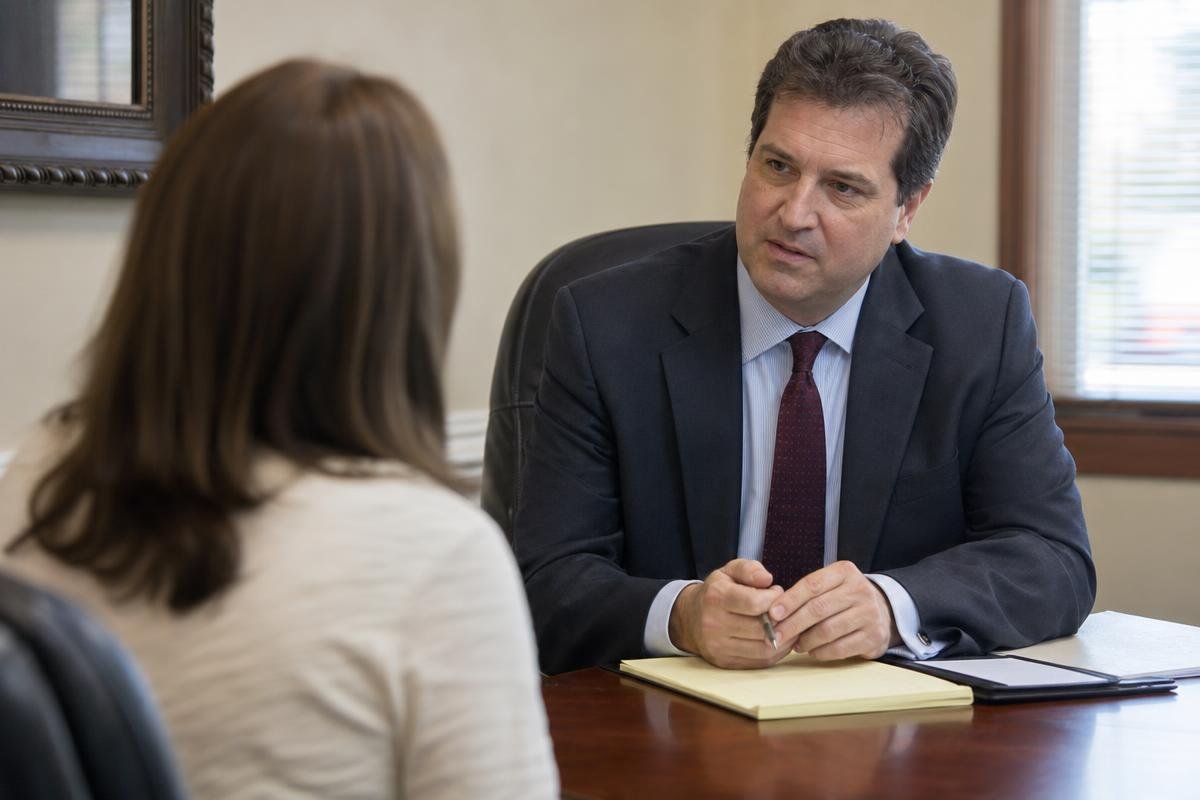 Personal injury lawyer in Alexandria, VA meeting with an injured client